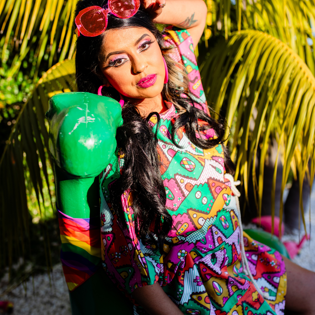Closeup of pretty model wearing bold geometric muumuu while resting in the sun