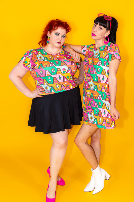 2 cute models in bold orange, yellow, green and pink geometric print clothing