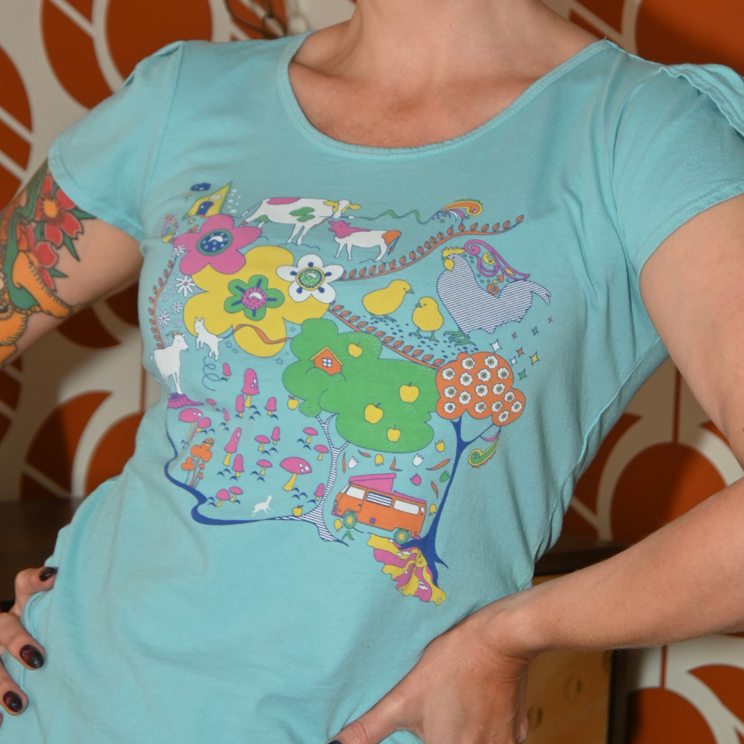 Closeup of cute model in light blue graphic tee with animals