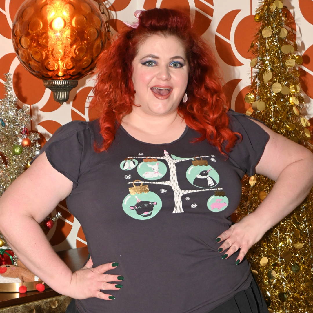 Plus sized happy model in holiday themed dark grey t-shirt