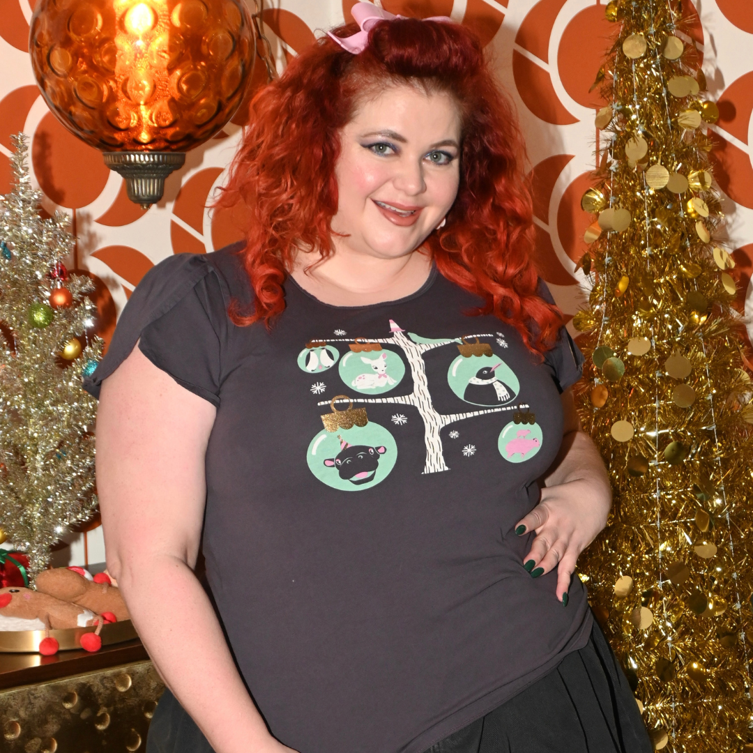 Plus sized happy model in holiday themed dark grey t-shirt