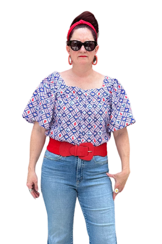 Square neck peasant top with blue and red print and graphic of fruit and flowers