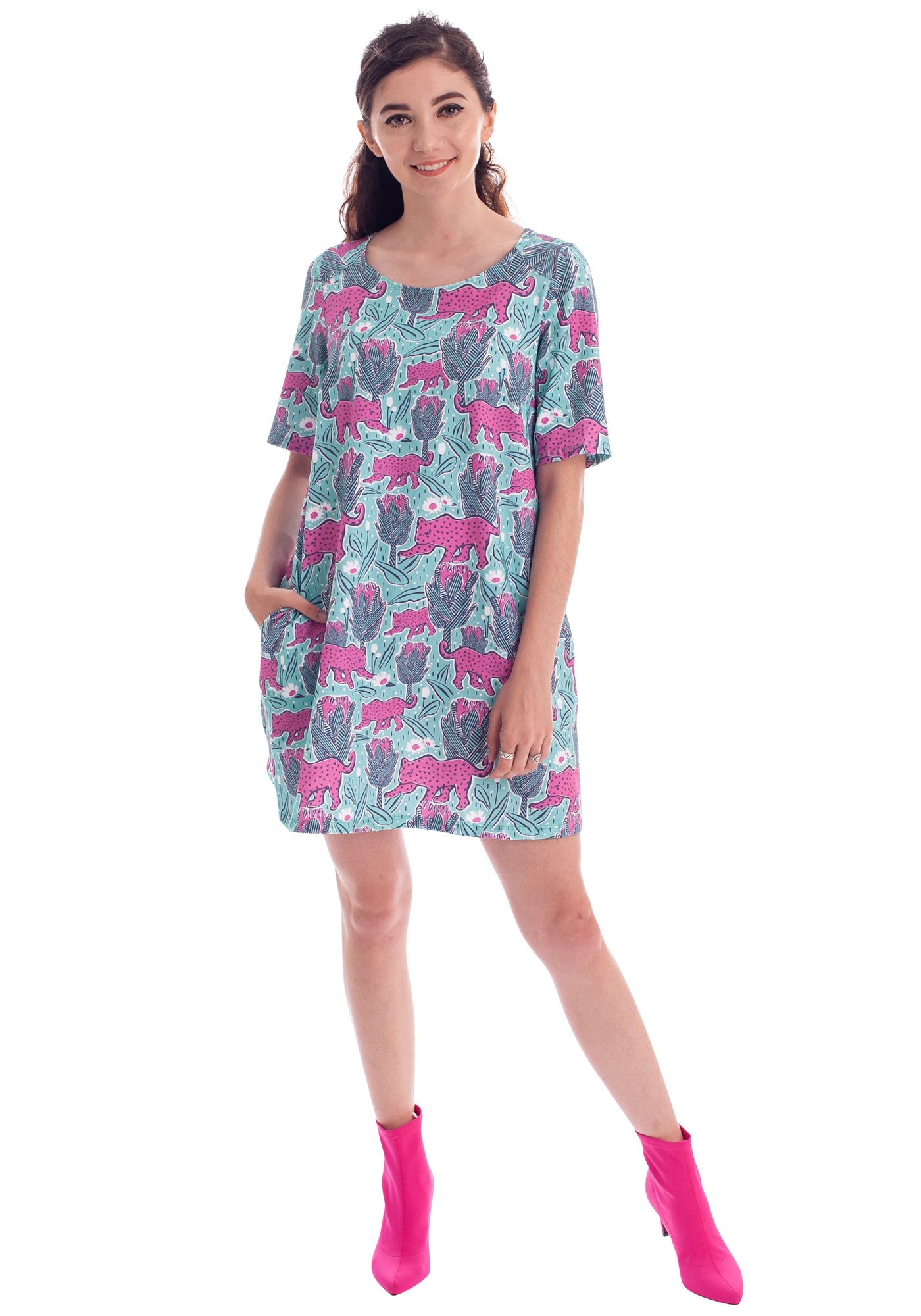 Model in mint green and pink pocket tunic with a print of protea flowers and jaguars