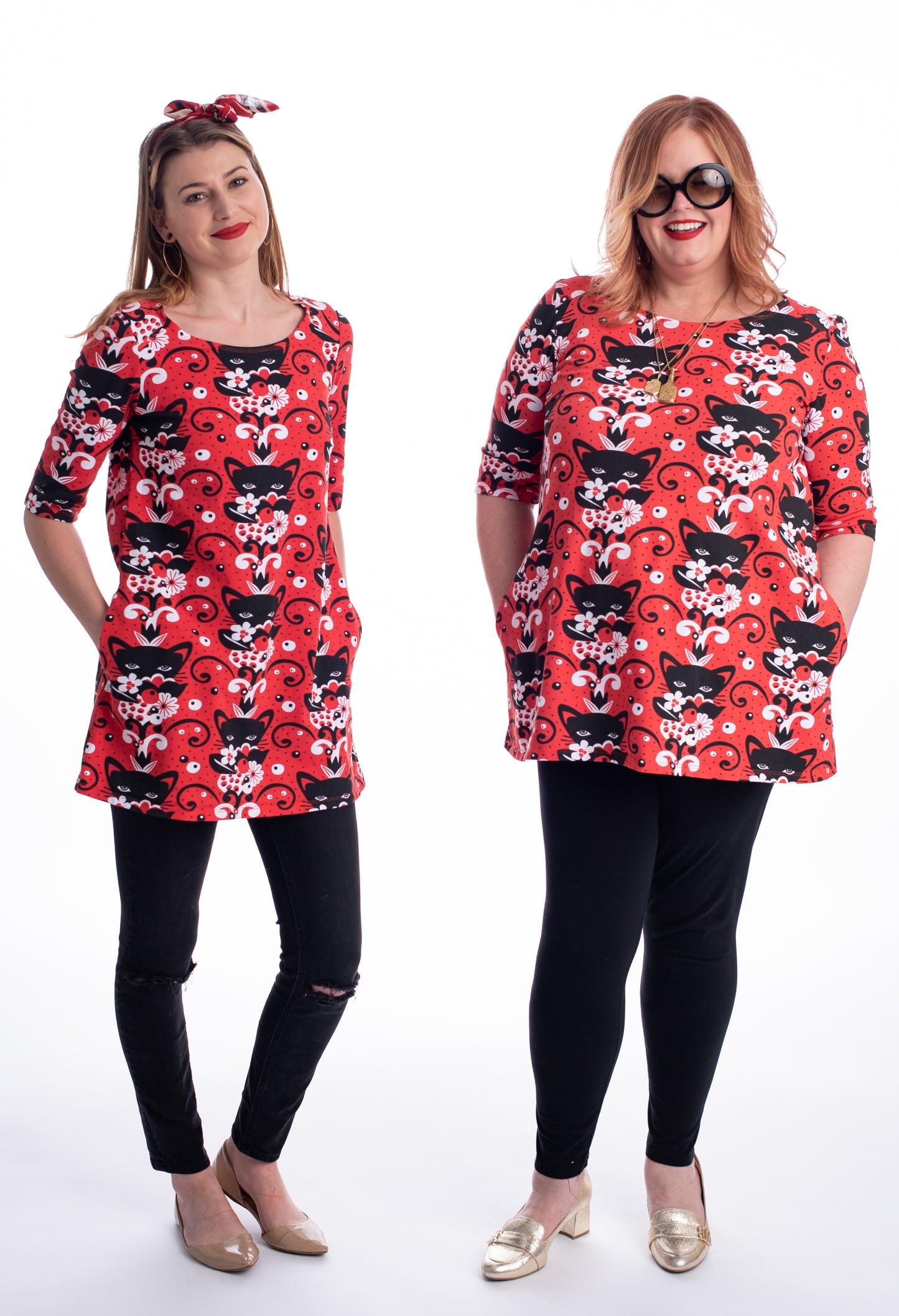 Red black and white a-line pocket tunic with  print of cats and flowers on 2 models