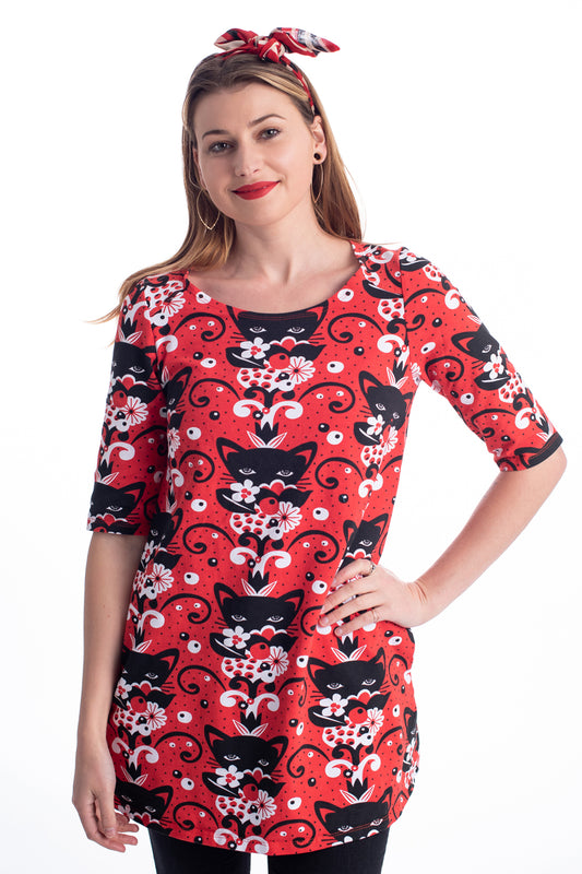 Red black and white a-line pocket tunic with print of cats and flowers on model