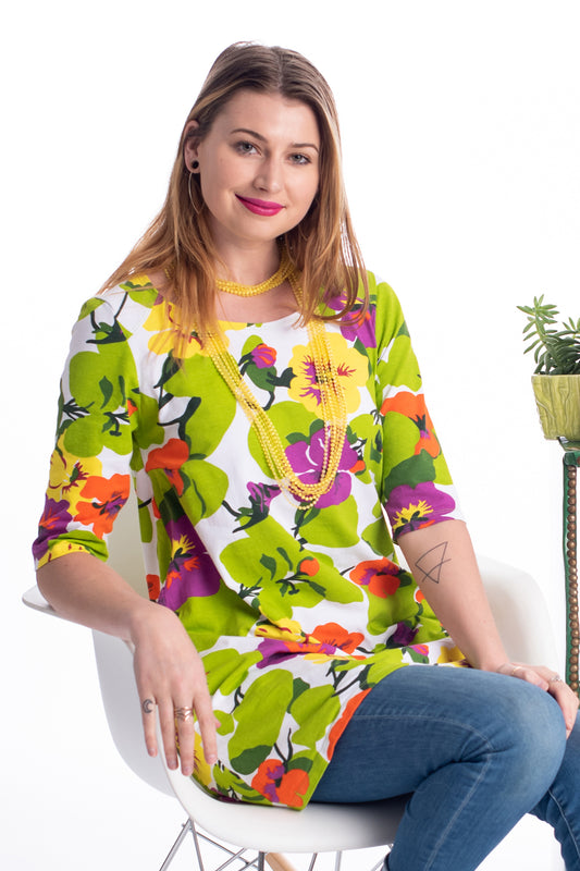 Blonde model wearing colorful shirt with flowers