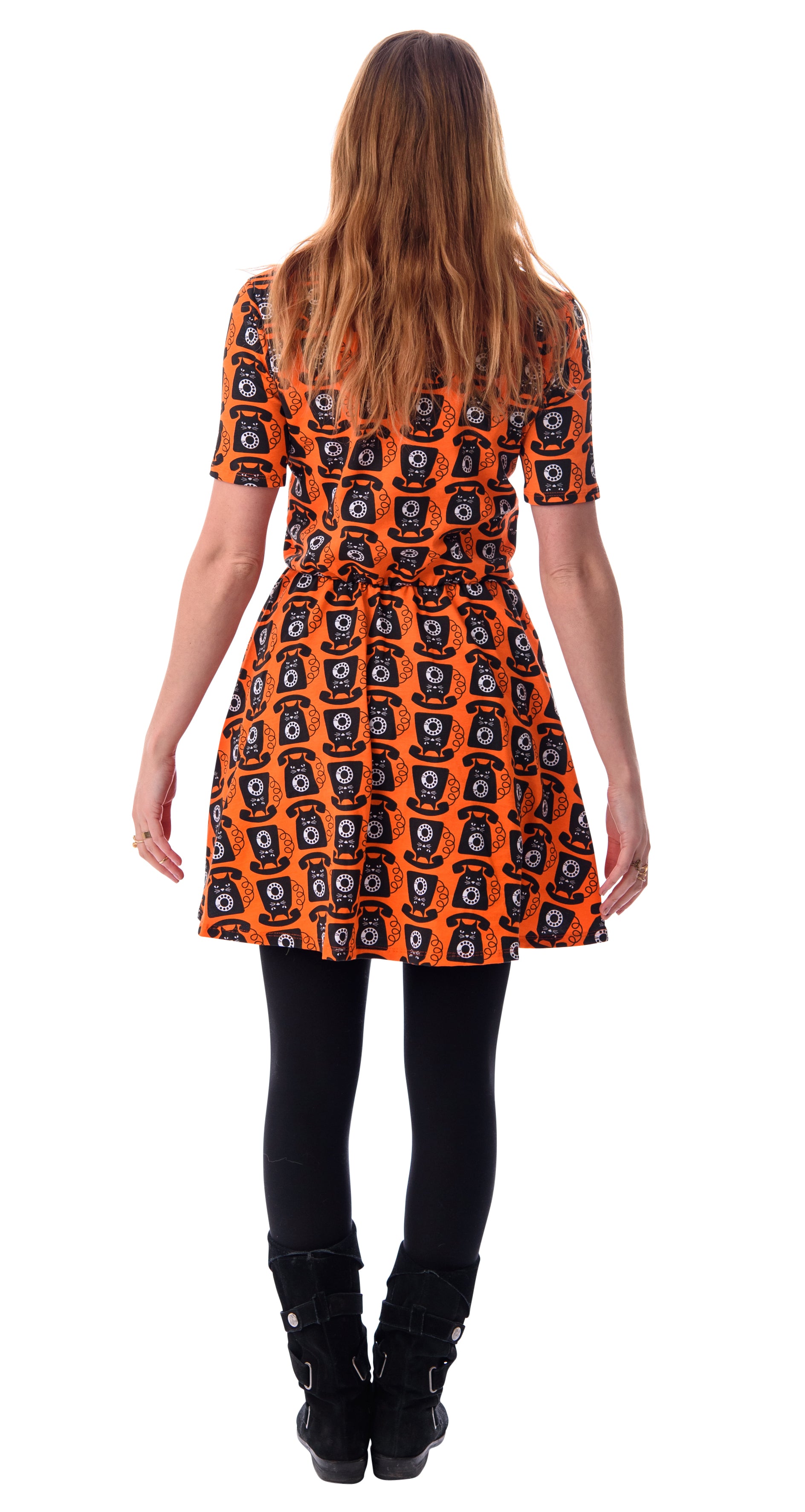 Back view of orange black and white cat phone print knit skater dress with elbow length sleeves, pockets and elastic waist
