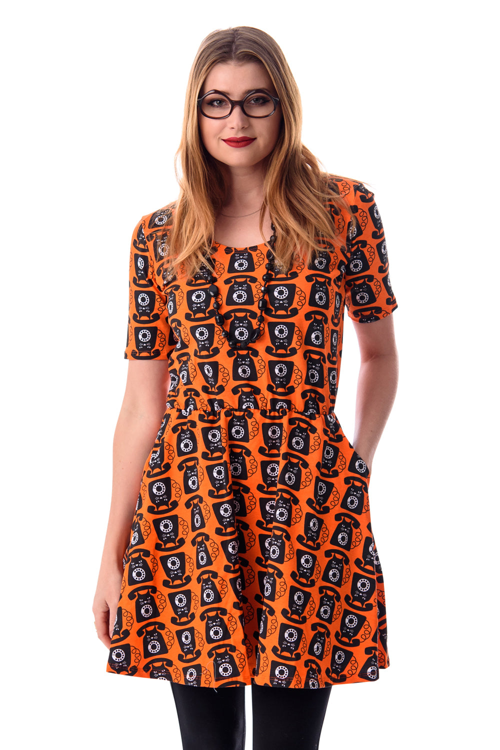 Orange black and white cat phone print knit skater dress with elbow length sleeves, pockets and elastic waist