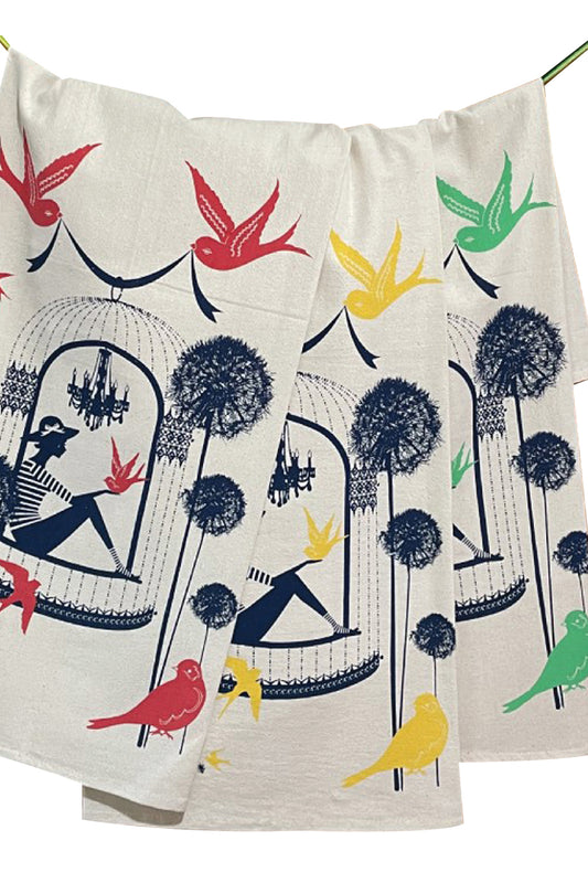 3 colorful cotton tea towels with birds and a woman in a birdcage