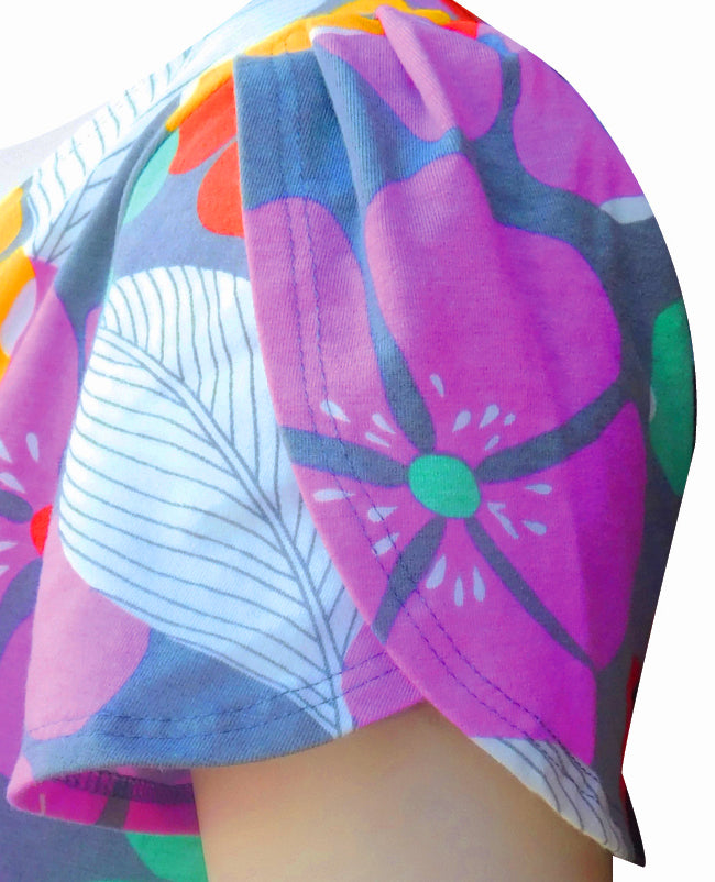 Close up of a colorful dress with tropical flowers