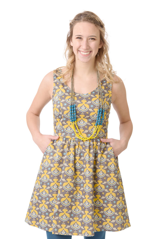 Grey cotton poplin fit and flare knee length dress with bright yellow, aqua and yellow acorn print