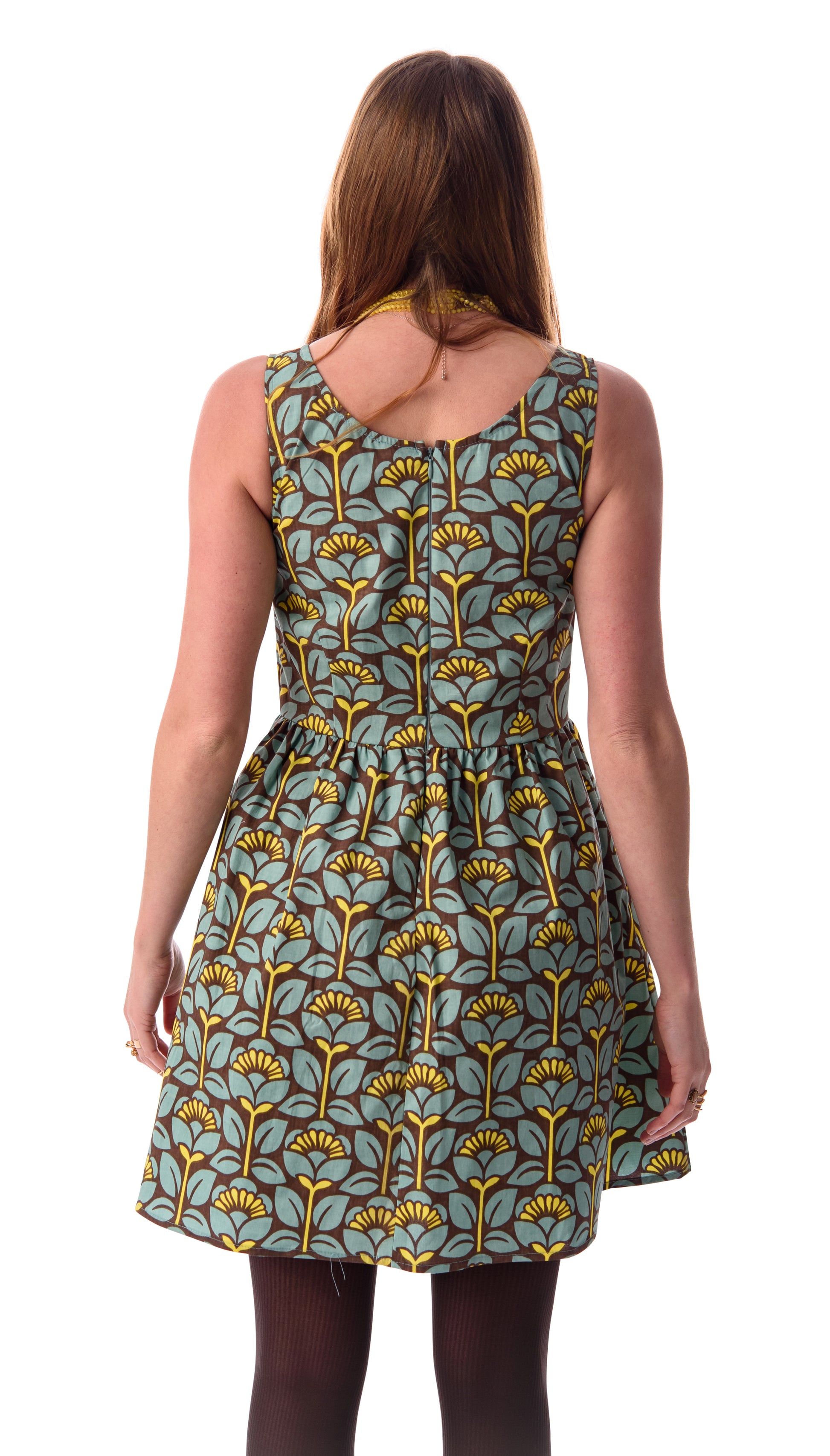 Back view of light blue, yellow and brown geometric floral retro print sleeveless fit and flare short dress