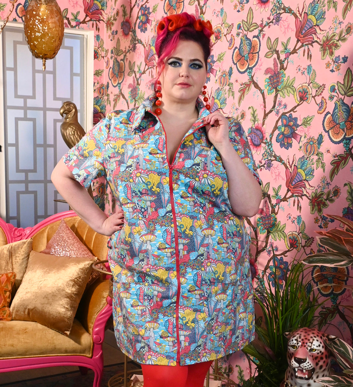 Red-haired model wearing mushroom print zip-front collared minidress