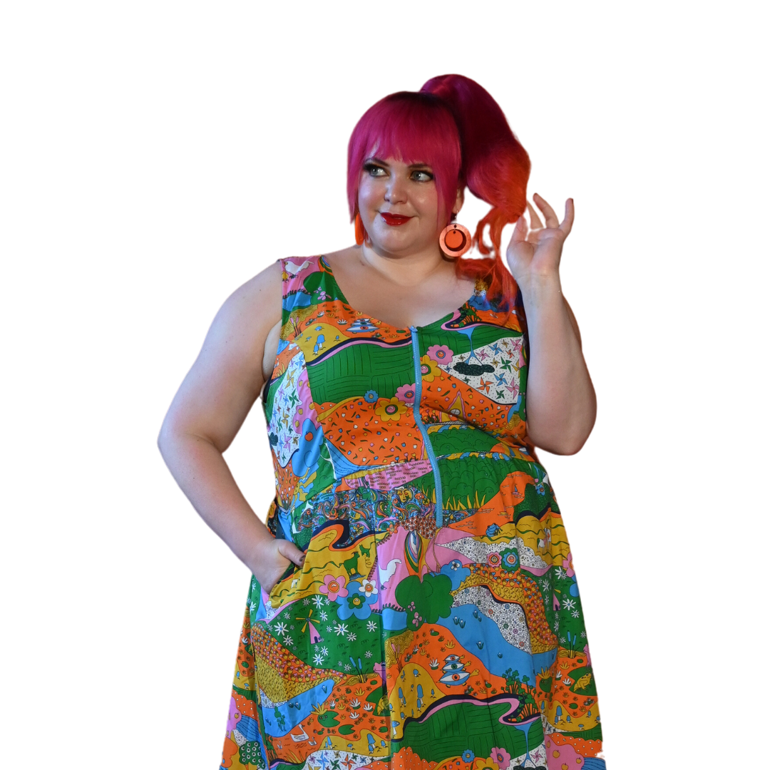 Pink-haired girl in rainbow colored landscape print fit & flare dress with pockets