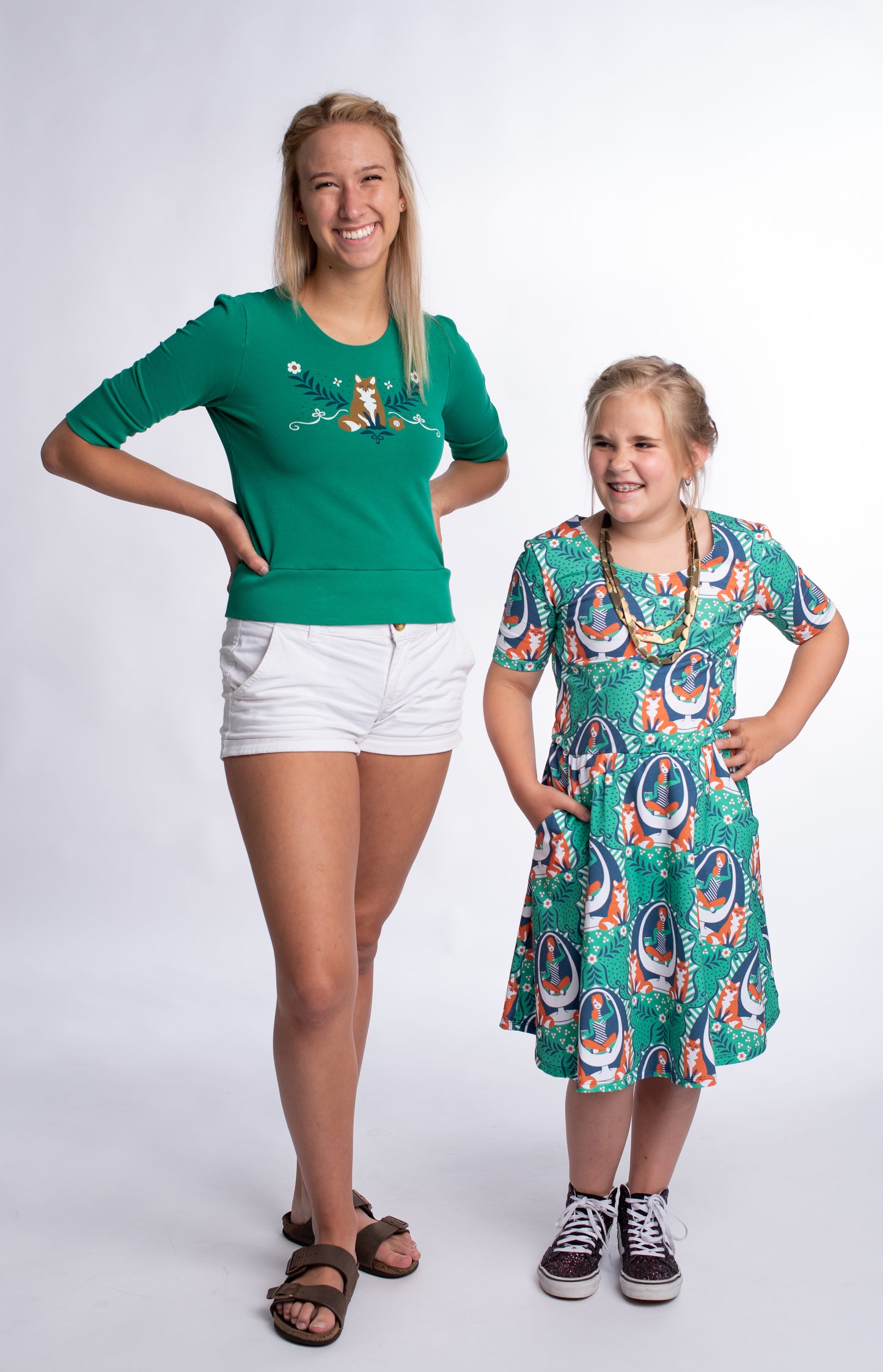 Cropped emerald green French terry top with fox print on model with child model in cute dress