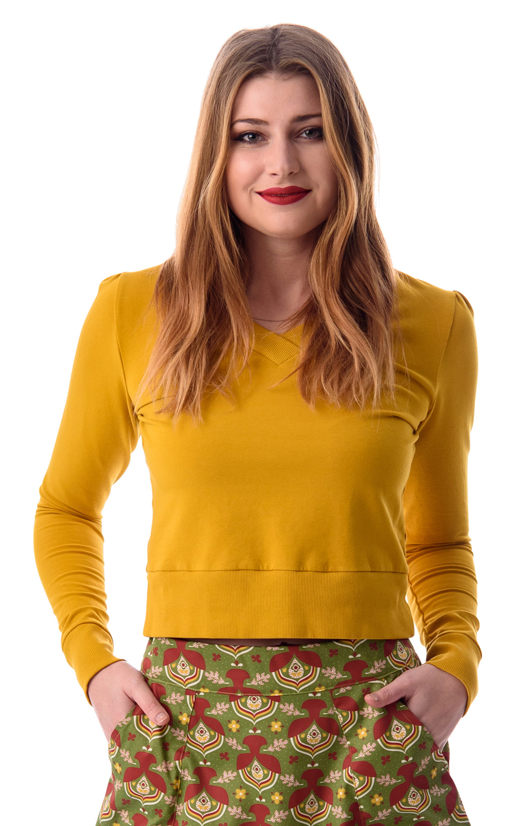 Mustard yellow v-neck French terry top on long-haired model with cute skirt