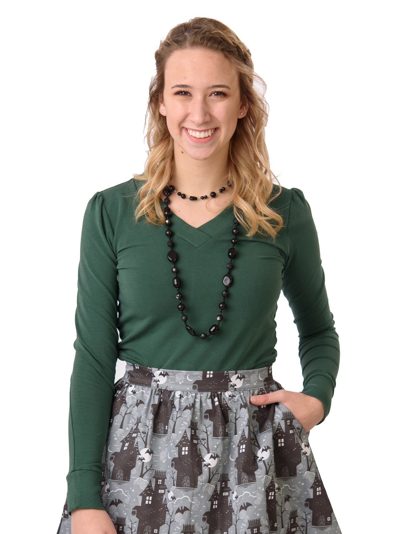 Cropped pine green French terry top with rib trim, paired with spooky skirt