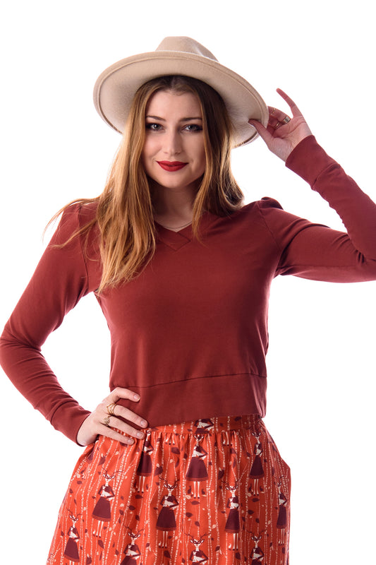 Cropped v-neck French terry top in rust brown with rib trim with cute skirt, tights and boots