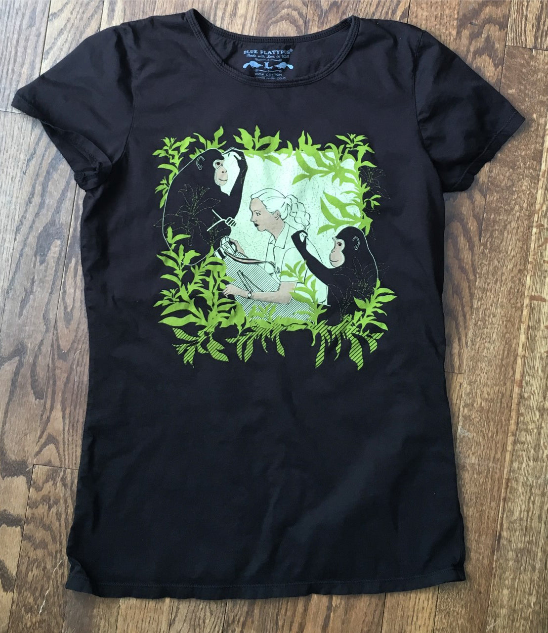 Dark brown tee with primatologist, jungle and chimpanzees