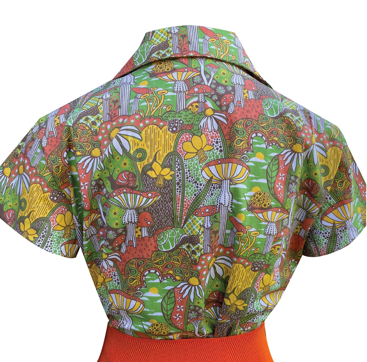 Closeup back view of olive green mushroom and daffodil print jumpsuit