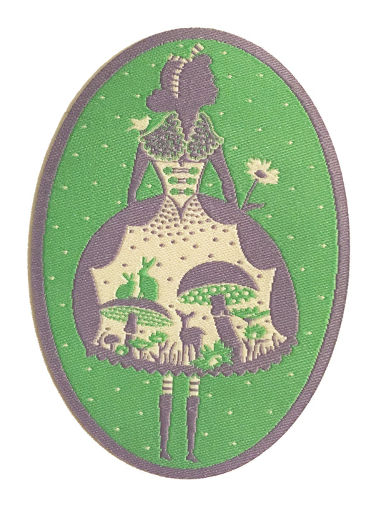 Green, grey and white oval patch with Alice in Wonderland design