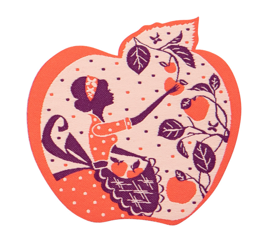 Purple and orange apple-shaped iron on patch with a girl picking apples