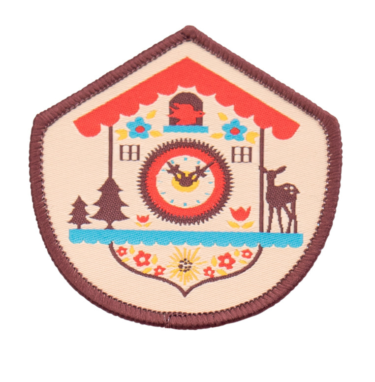 Brown red yellow and blue woven patch with a Bavarian cuckoo clock and brown border