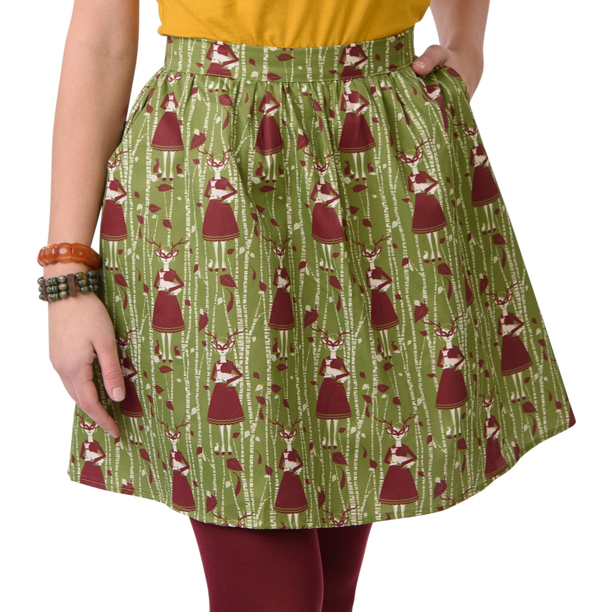 Gathered olive green and brown skirt with deer, birches and masked girl print and pockets