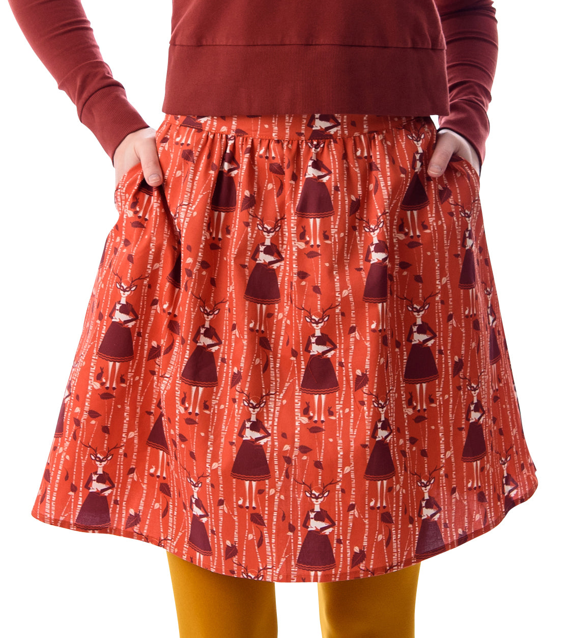  Orange and brown skirt with deer, birches and masked girl print and pockets