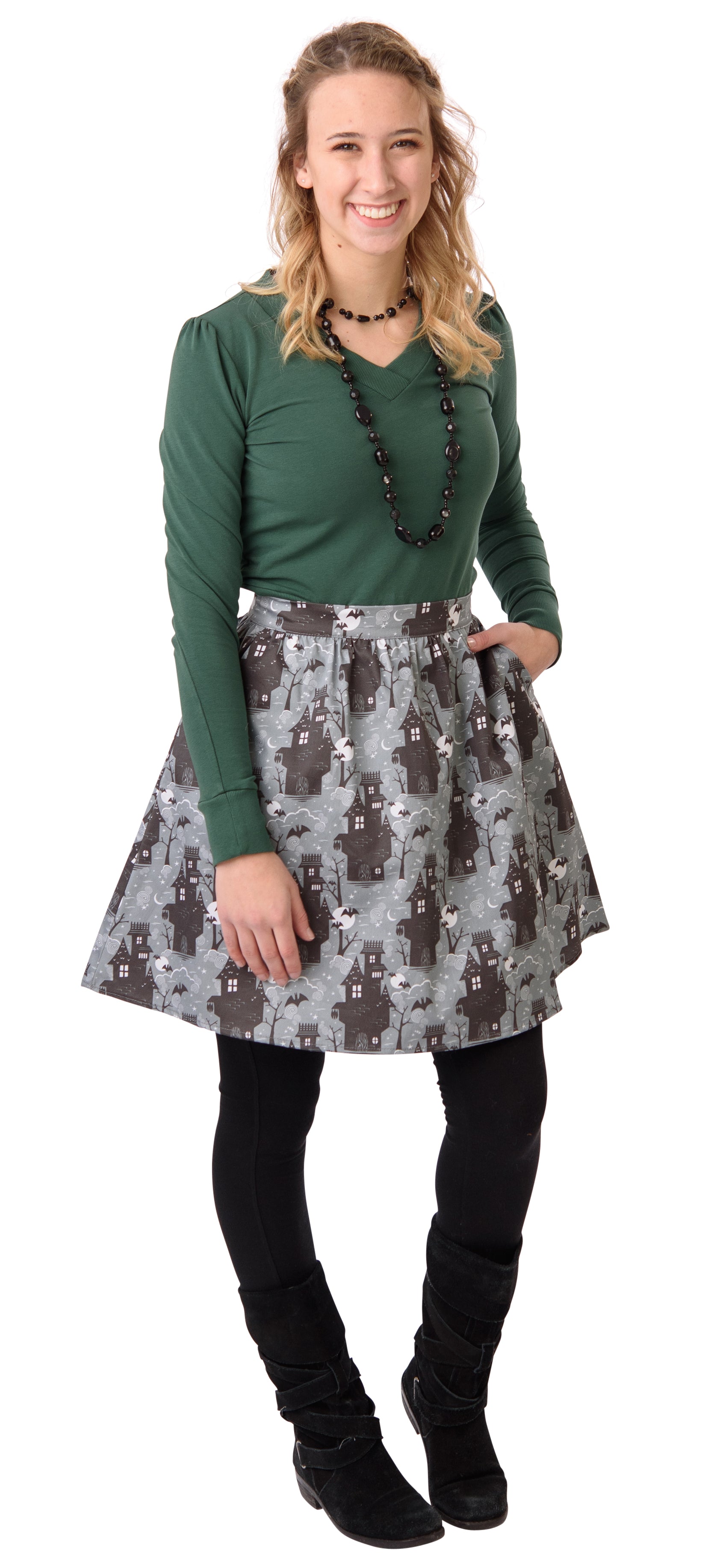 Grey ruched haunted house print short skirt on model with pine green v-neck shirt