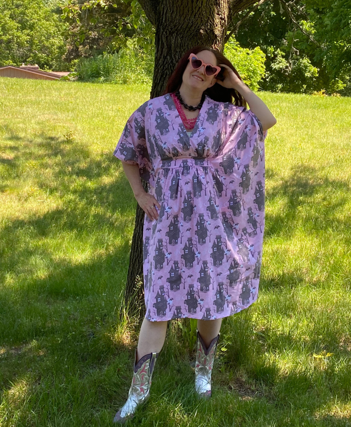 Silly person in pink and grey haunted house print caftan dress