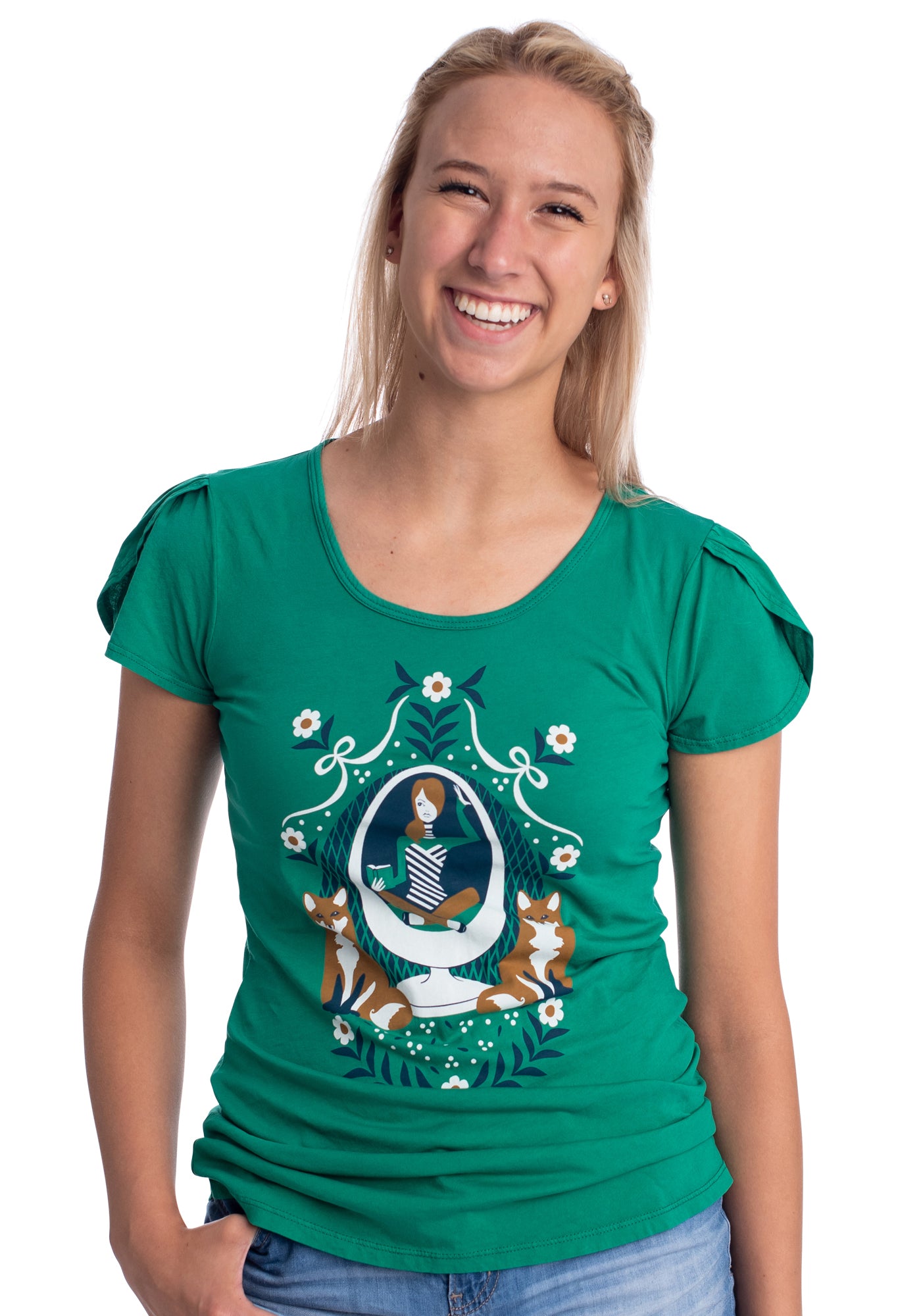 Emerald green tulip-sleeved graphic tee with girl reading a book in an egg chair with 2 foxes