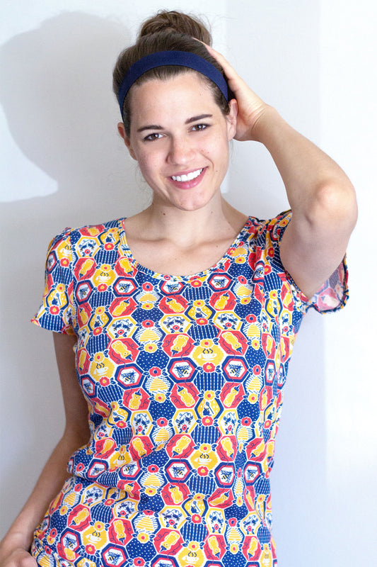 Red, yellow and blue honeycomb, flower and honey bee print tulip-sleeved tee