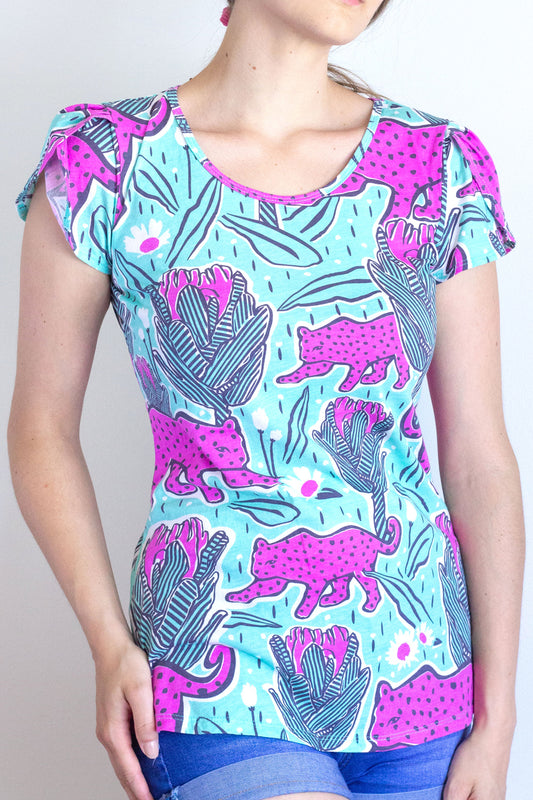 Mint green and orchid pink tulip-sleeved tee with jaguars and tropical flowers