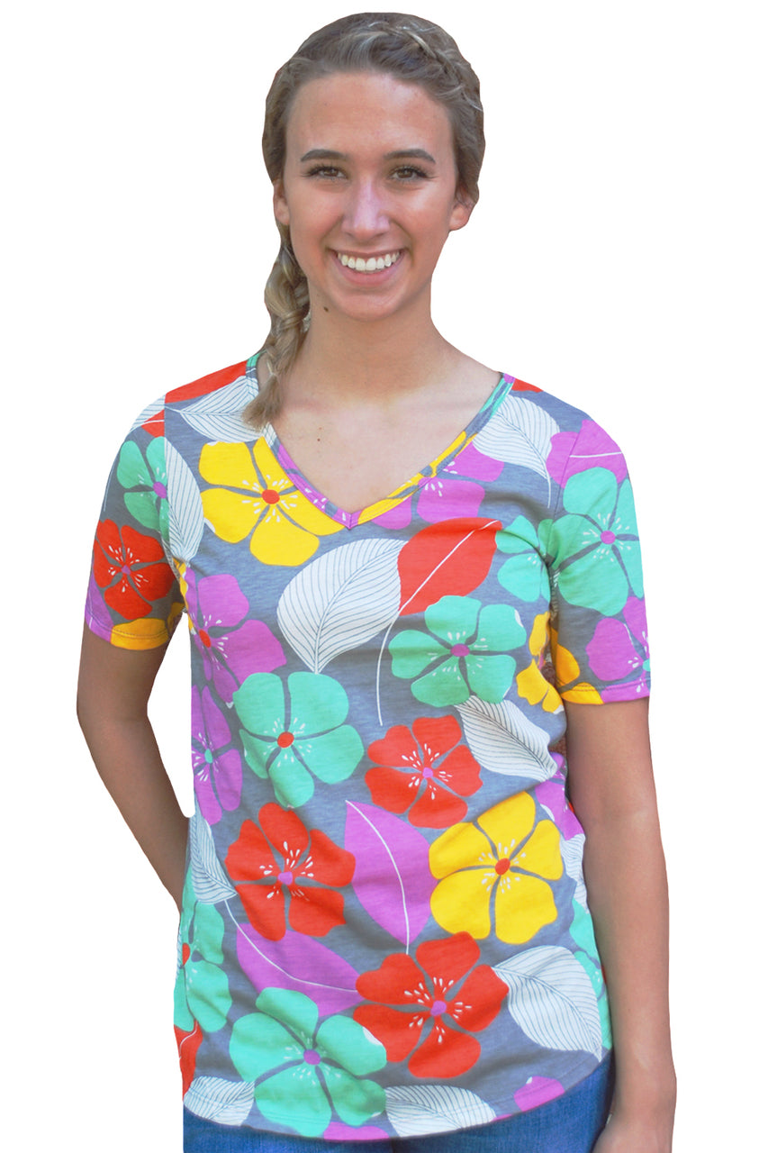 Model wearing multicolored tropical floral v-neck tee