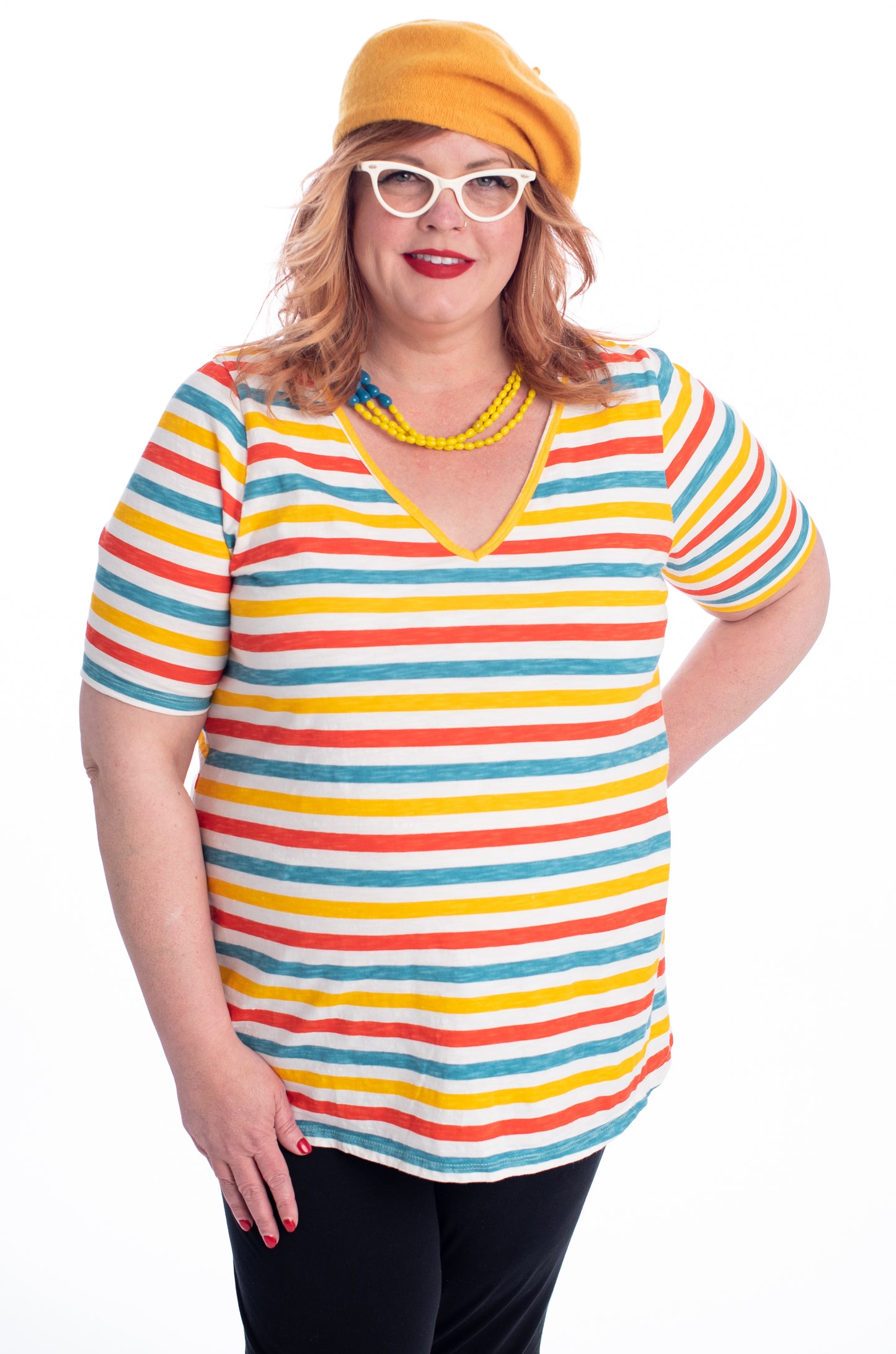 Orange blue and yellow v-neck striped plus size tee on model in beret