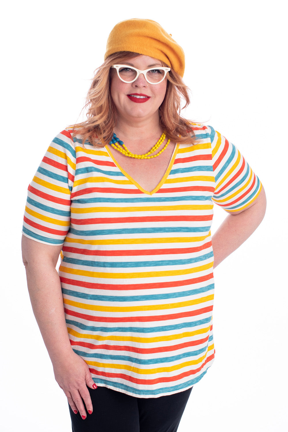 Orange blue and yellow v-neck striped plus size tee on model in beret