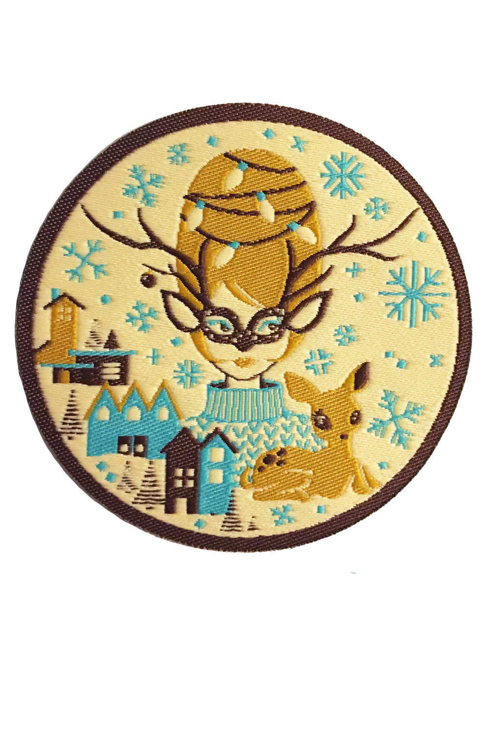 Round iron on patch with brown, gold and aqua print of Christmas girl with beehive hair, deer and putz houses