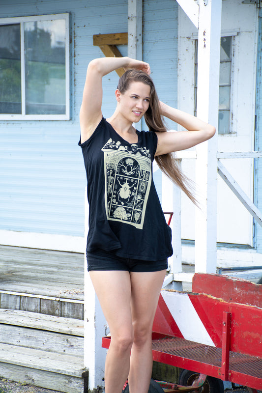 Black scoopneck cap-sleeved trapeze top with white cabinet of curiosities print