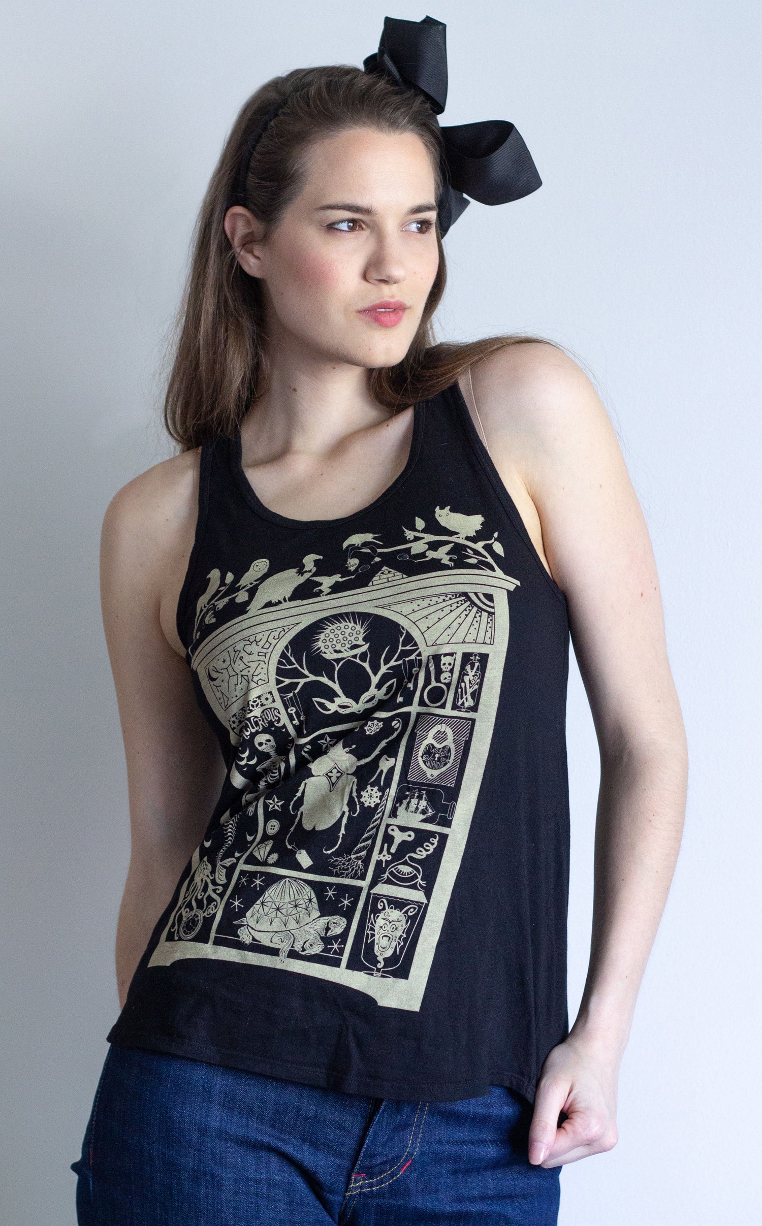 Model wearing black racerback tank with cabinet of curiosity print 