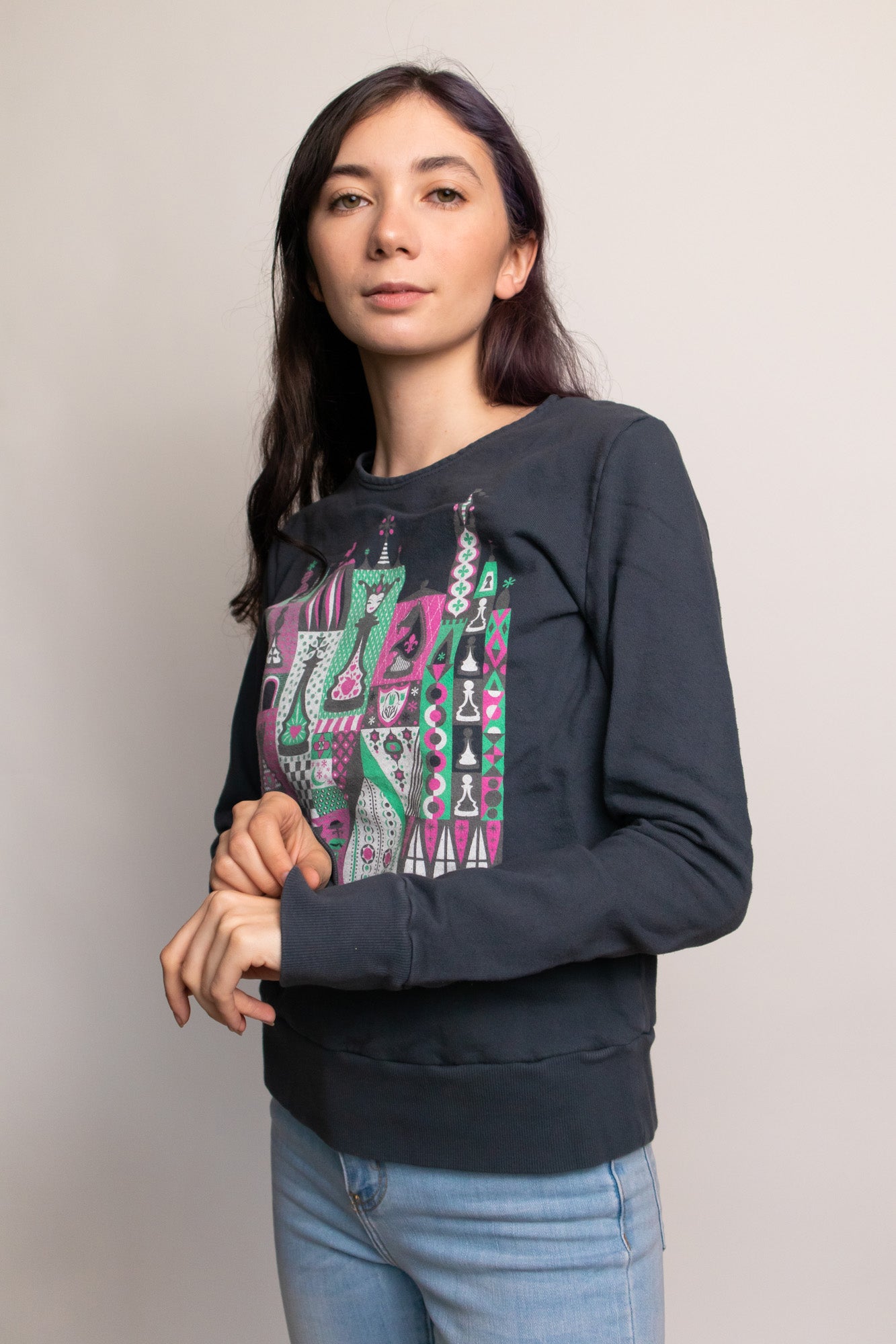 Grey chess print pullover sweatshirt on young woman