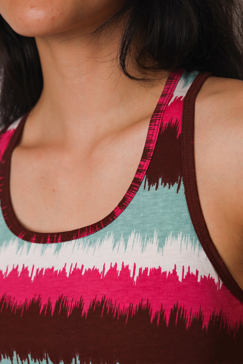 Close up of pink, blue and white striped tank top